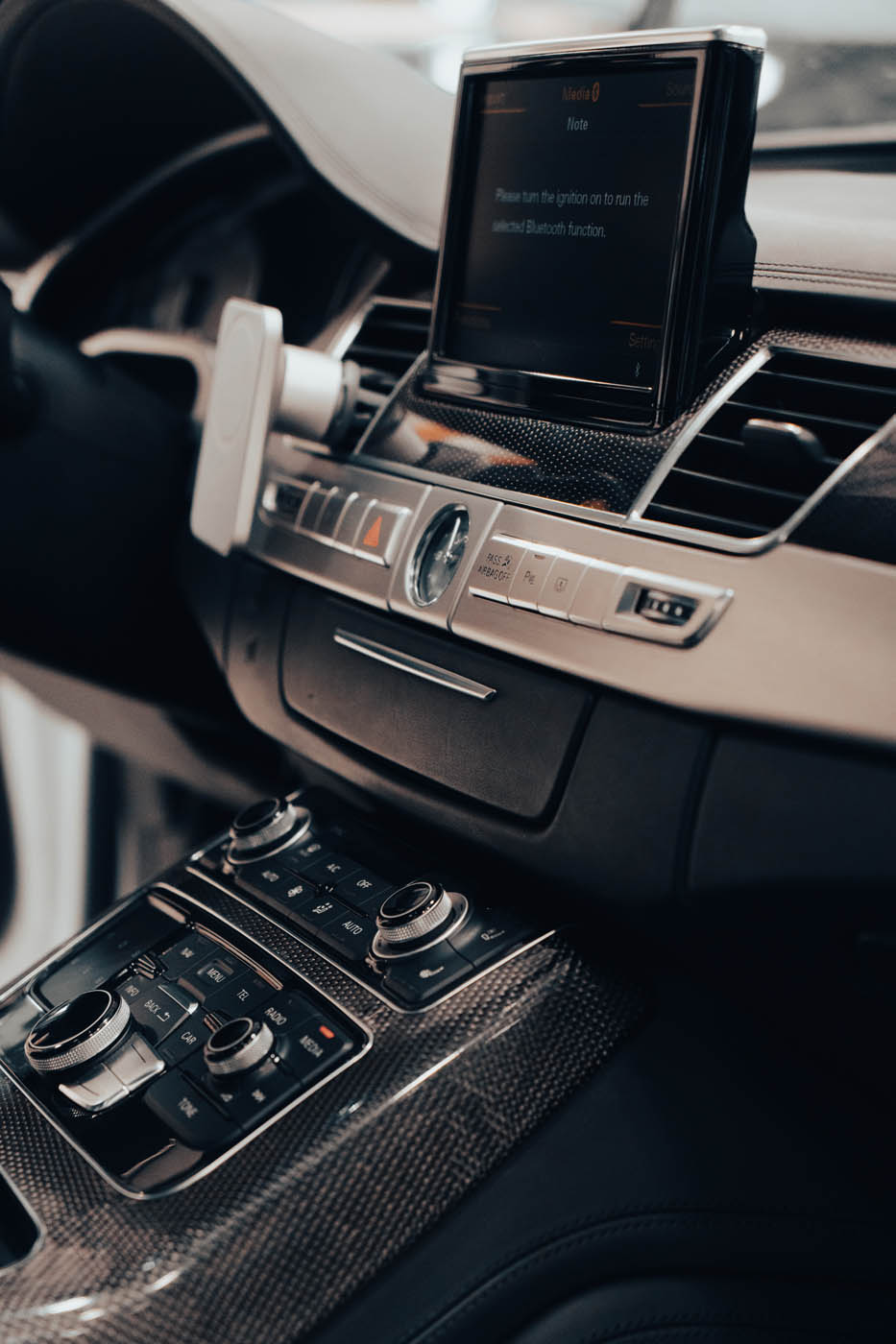 Image of a cars center console recently serviced by Dapper Pros's professional car detailing in Mission Valley, CA.